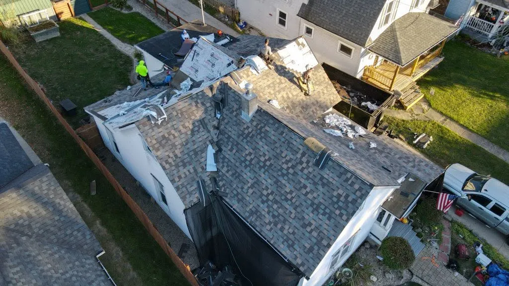 Apex crew tearing off an old roof